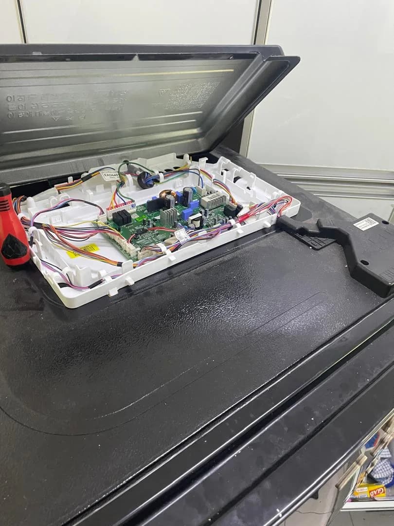 Exposed refrigerator control board and wiring