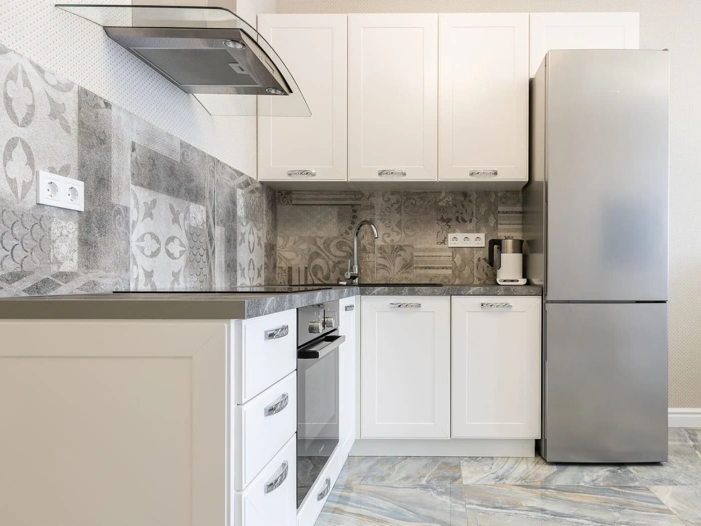 Stainless-steel fridge in a contemporary fitted kitchen